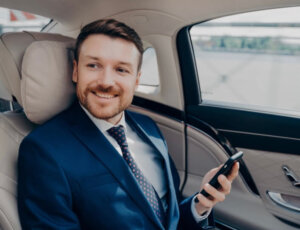 Business traveler using Canton Airport Car Service in executive sedan