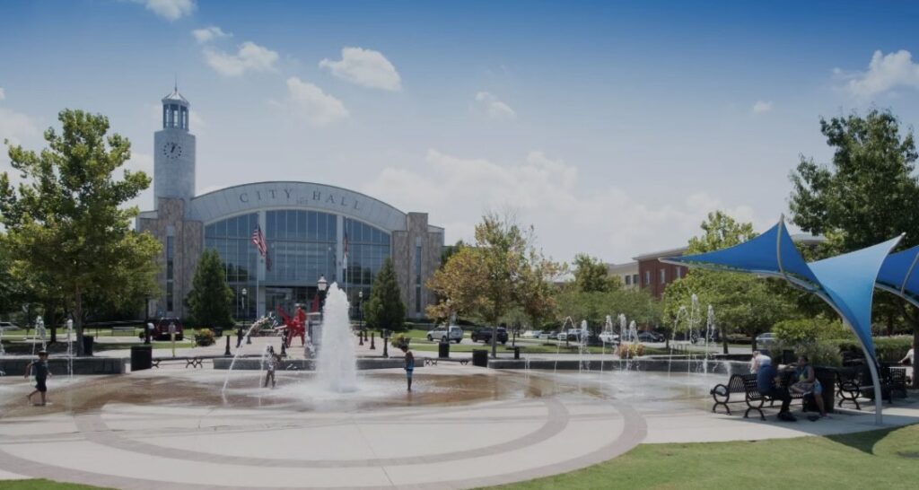 Suwanee City Hall and Town Center Park fountain on a sunny day – Suwanee limo service area highlight